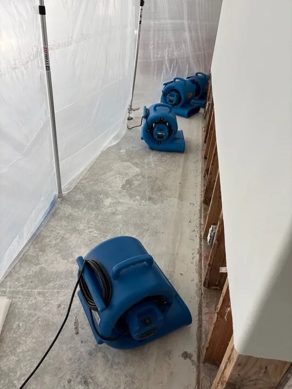 Basement water damage air movers containment