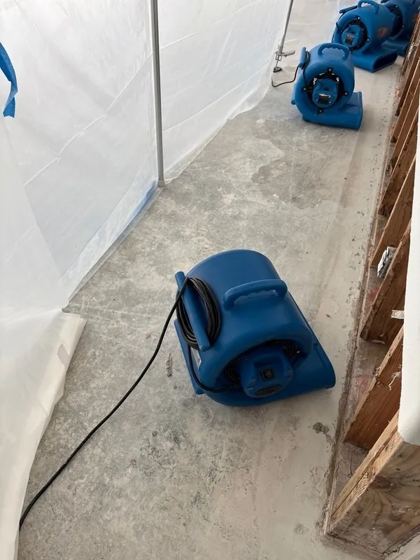 Basement water damage containment drying
